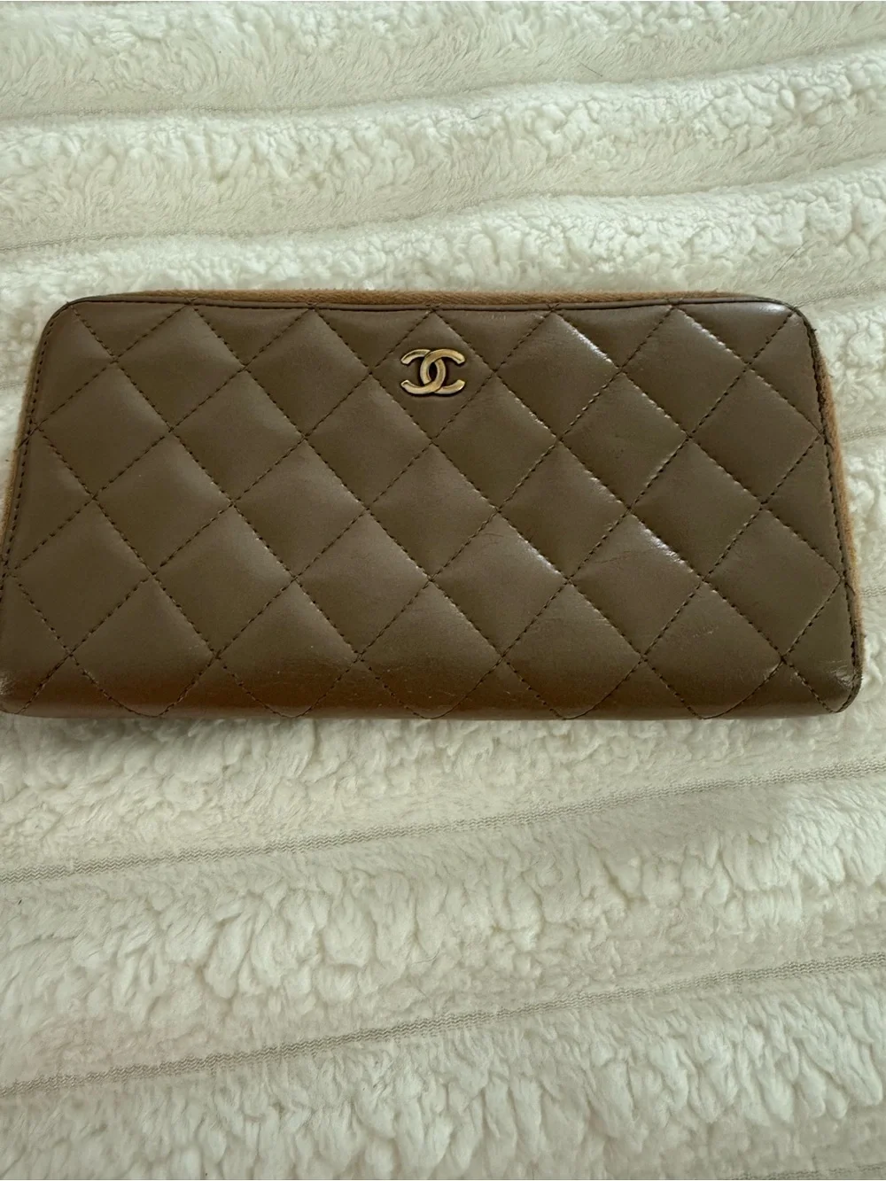 CHANEL Quilted Leather Zip Wallet in Brown with Gold CC